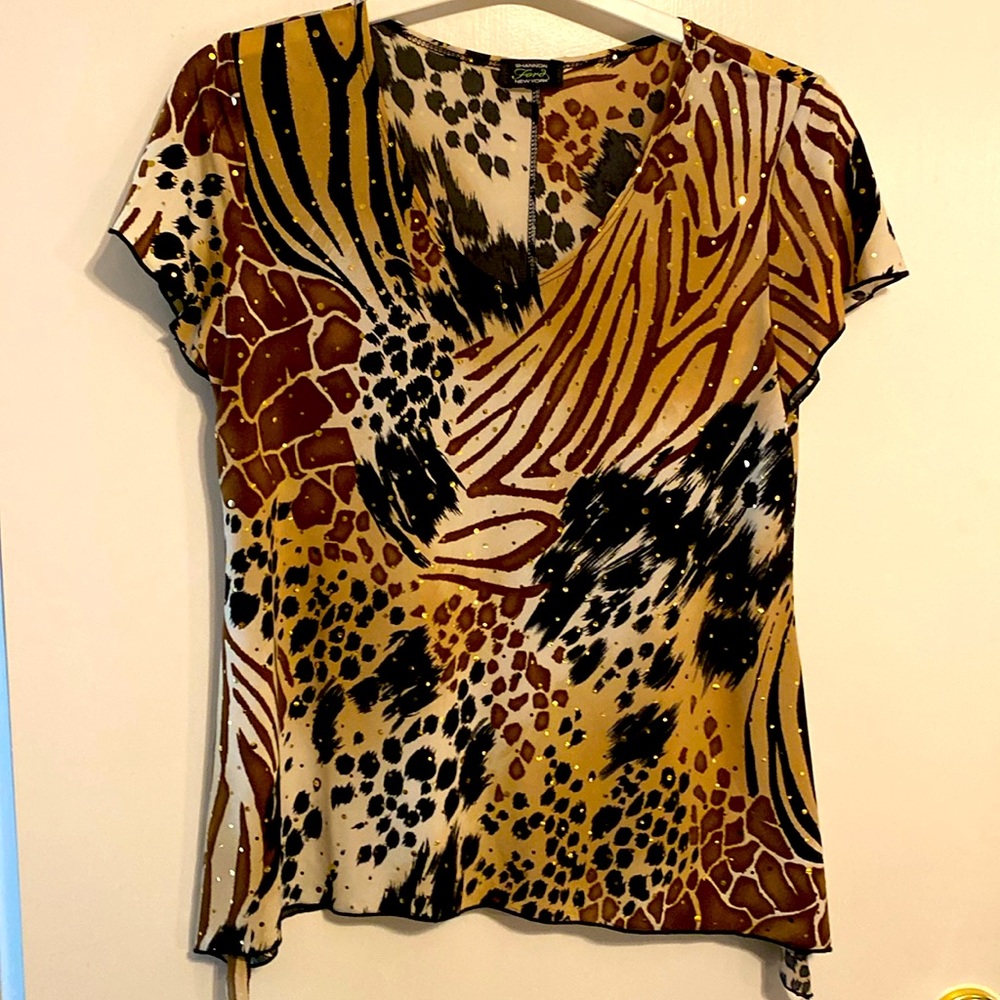 Shannon Ford NY top with gold sparkles over various animal prints. Size small.